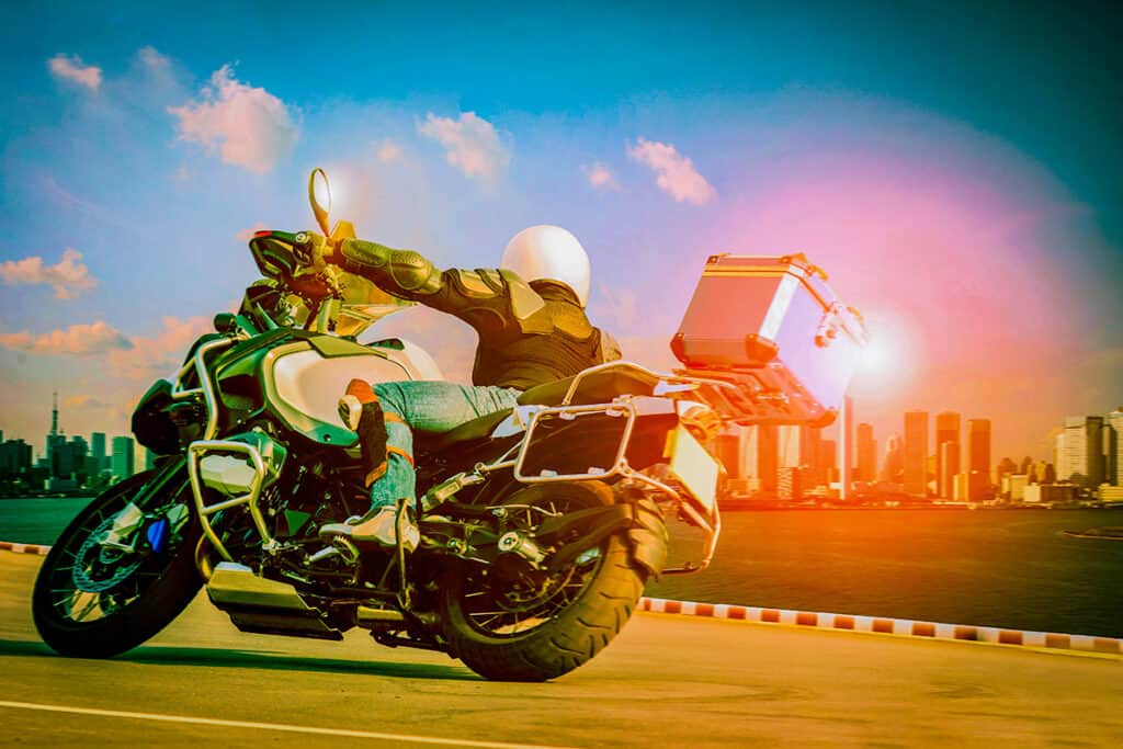 Motorcycle driving on asphalt with city scape background