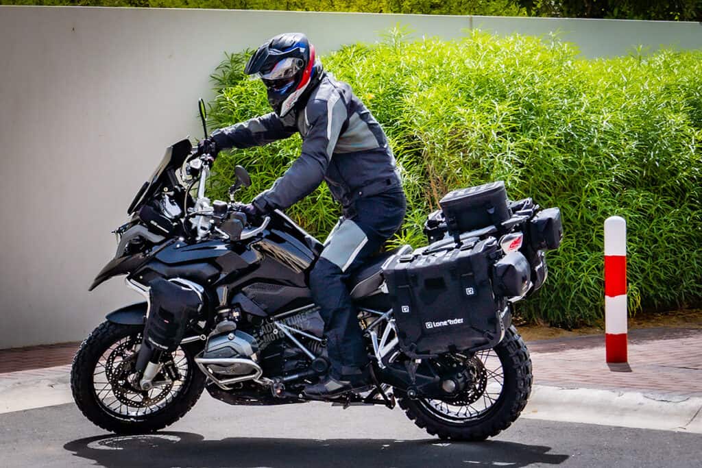 BMW R1200GS LC with standing rider on pavement