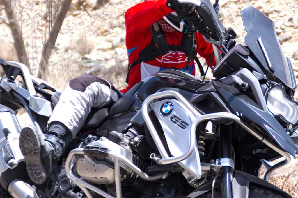 Rider falling off BMW R1200GS motorcycle