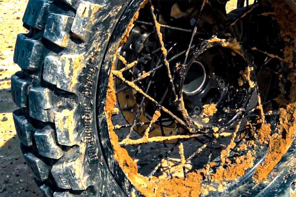 Adventure motorcycle tire with mud