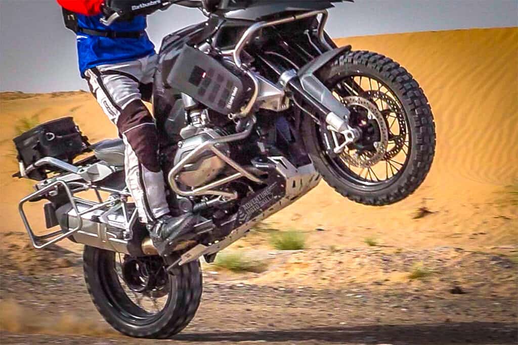 motorcycle doing a wheelie to show proper foot position