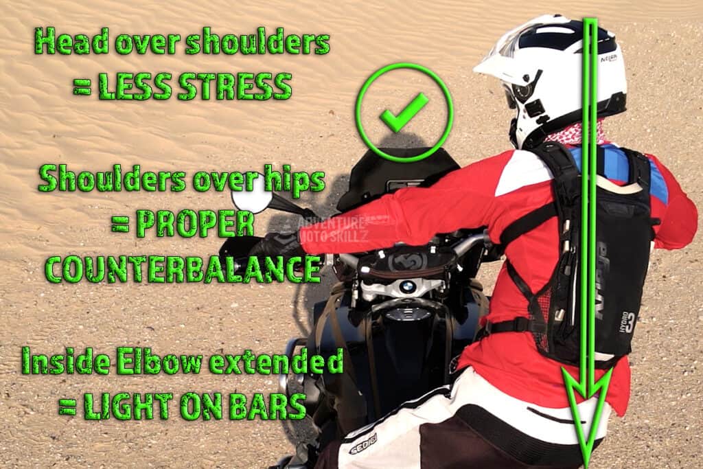 Proper shoulder positioning for an off-road motorcyclist during cornering