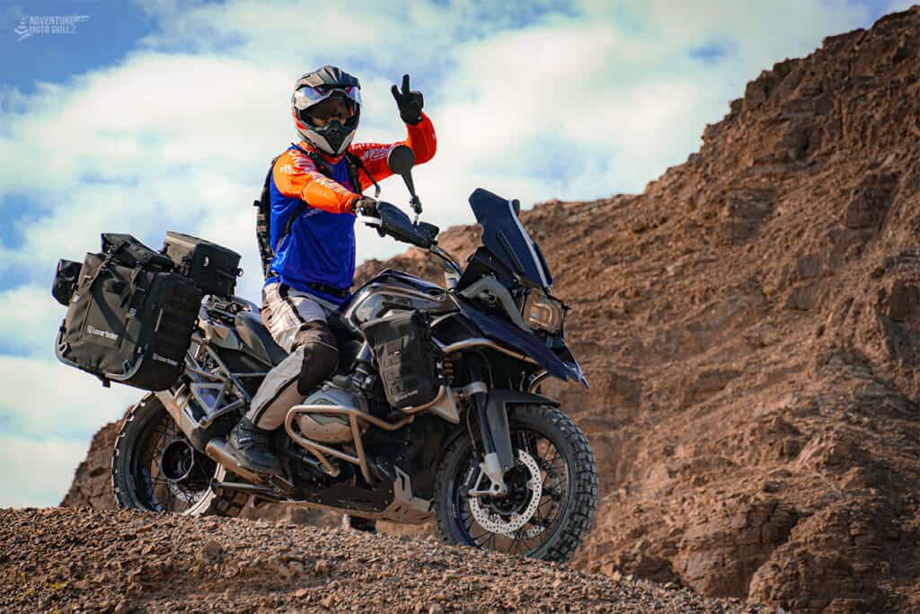 motorcycle rider sitting on BMW 1200GS in the mountains