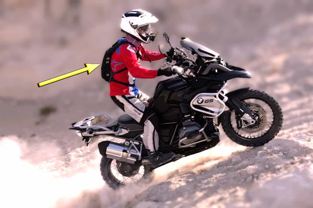 Motorcycle rider on BMW GS1200 wearing a Kriega hydration back pack