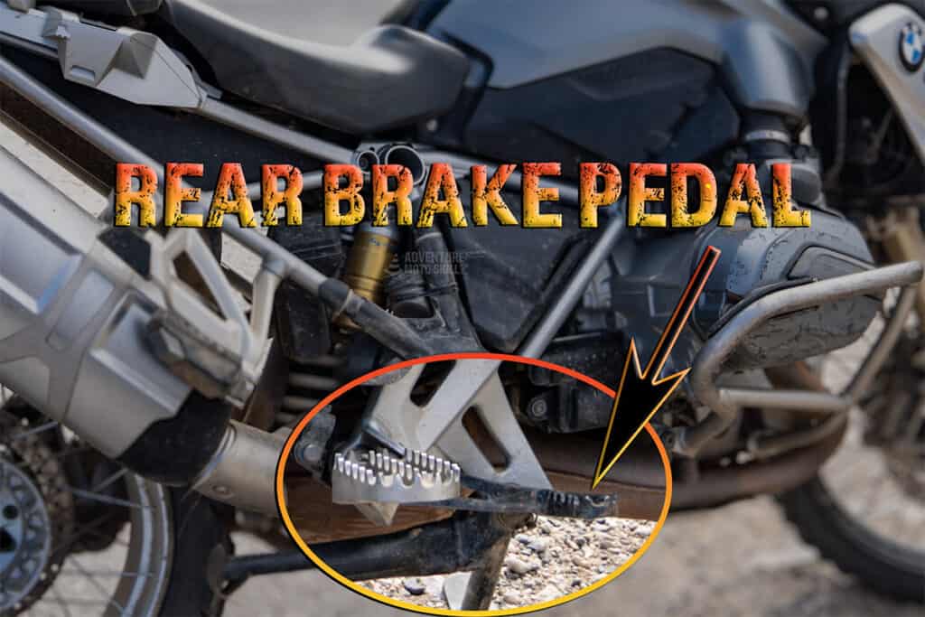 Rear brake pedal in front of right foot peg on motorcycle